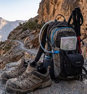 Sturdy hiking shoes and a daypack ready for the Jabal Shams Balcony Walk