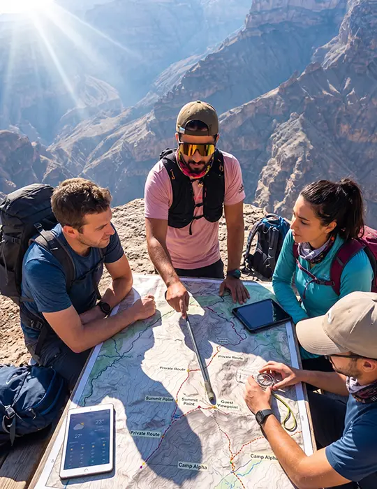 Local Oman guide Ali planning a private mountain tour with guests