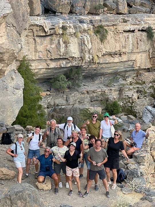 group of toursts posing for photo during the Balcony Walk, Jabal Shams
