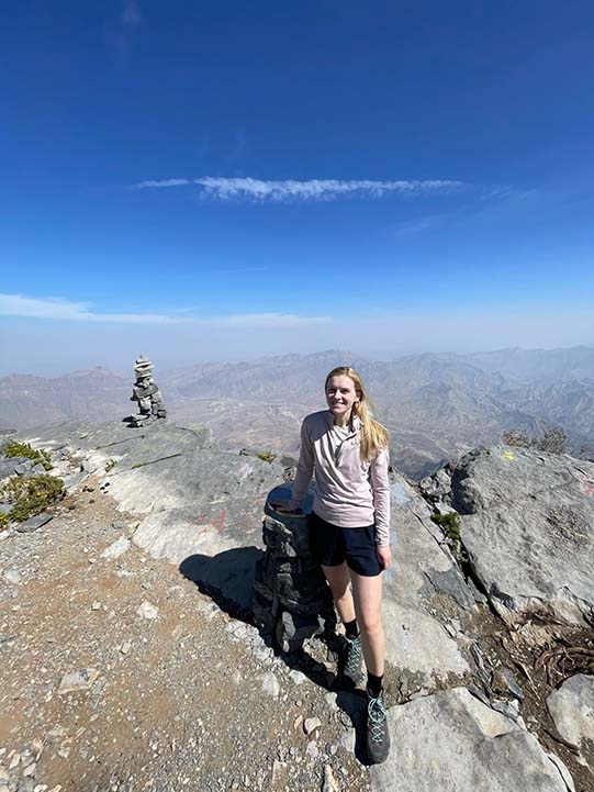 a girl in the cliff of Jebel Shams