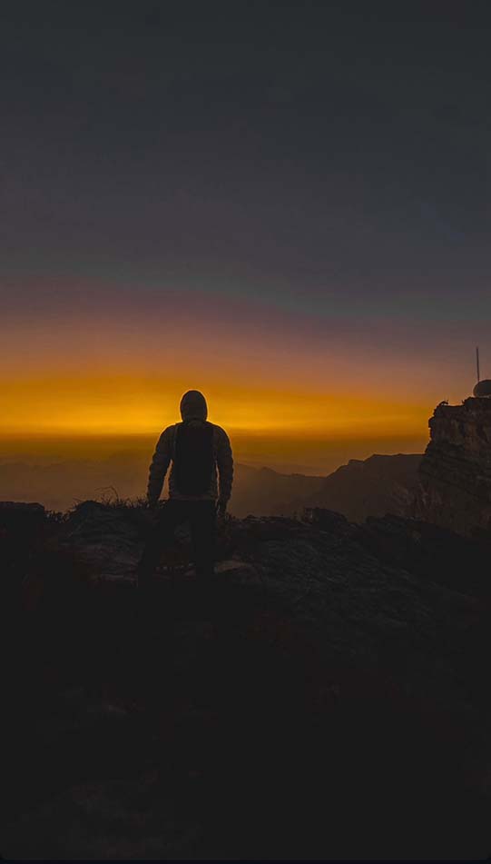 Sunset light over the mountain ridges of Jebel Shams
