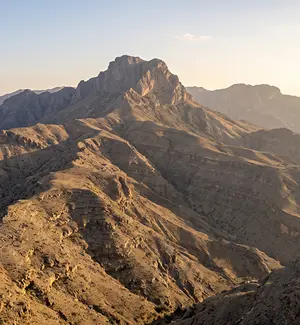Late afternoon light over the ridges below Jebel Hat in Al Dakhiliyah, Oman
