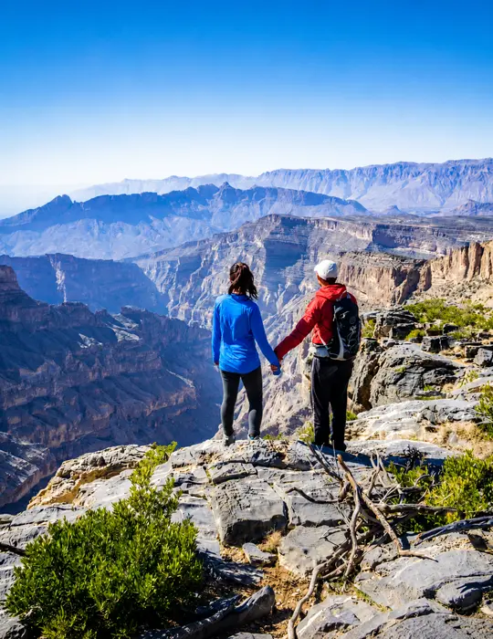 couple hand together in Jabel shams balcony walk