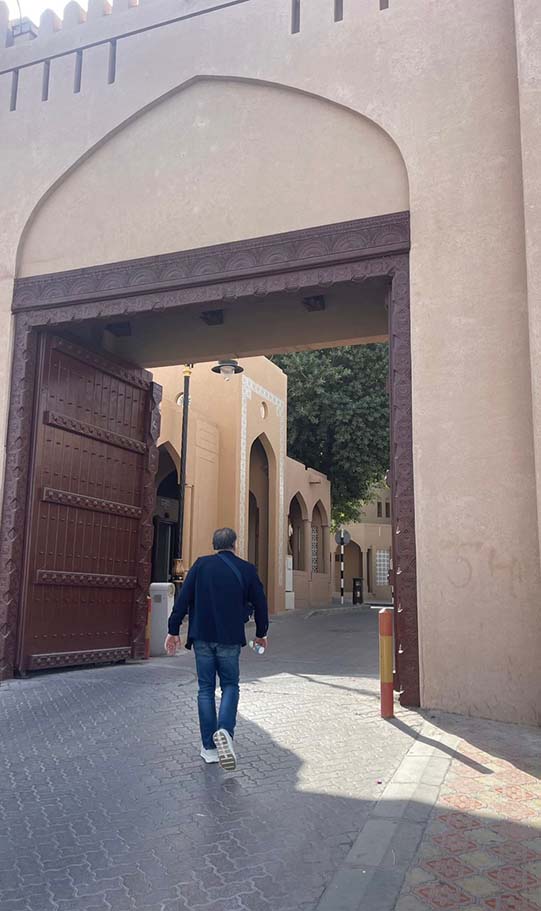 a man entering nizwa souq