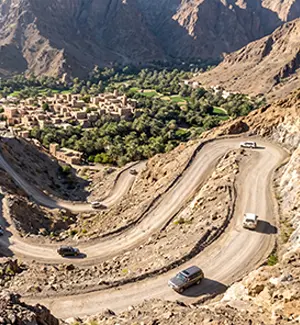 Rocky switchbacks of the Wadi Bani Awf mountain road leading up to Bilad Sayt