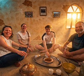 Guests sharing a meal inside the villa