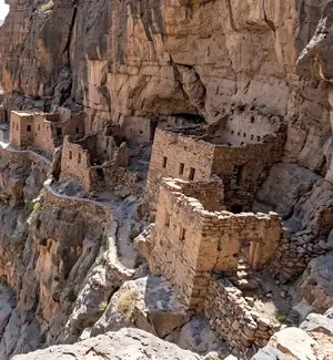 Stone houses of the abandoned village of Sab Bani Khamis on the walls of Wadi Ghul