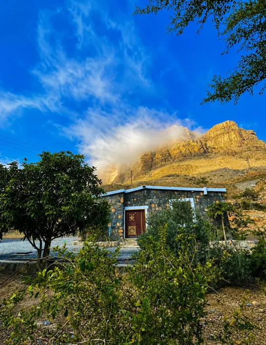Exterior of Jebel Shams Villa with mountain backdrop