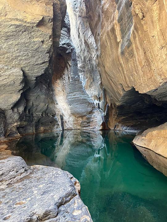 waterfall view during wadi ghul adventure tour