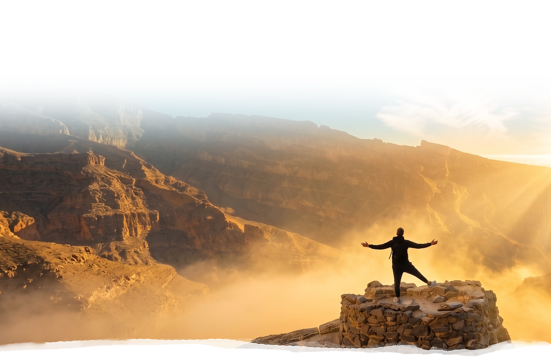 Traveller on a rock platform above the Jabal Shams canyon